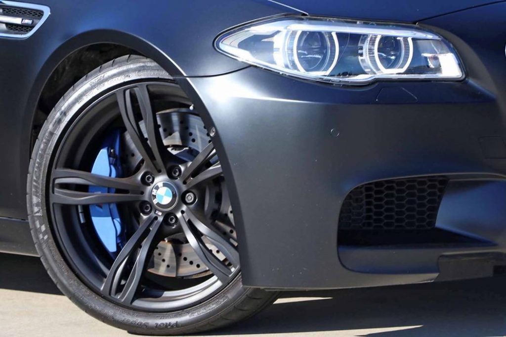 BMW M5 Nighthawk Alloy Wheels with Drilled Brake Rotors and Blue Calipers showing