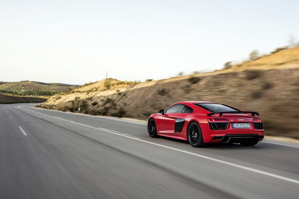 Catalunya Red Audi R8 V10 plus rear angle driving on open road