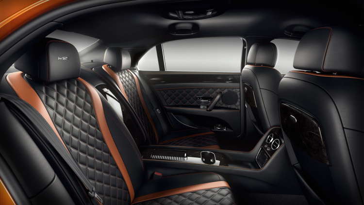 Bentley Flying Spur W12 S interior shows rear seats with black leather and orange accents