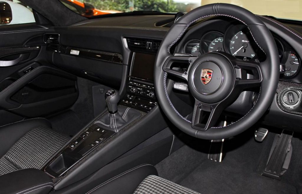 Porsche 911 R interior with manual gearbox and black leather seats