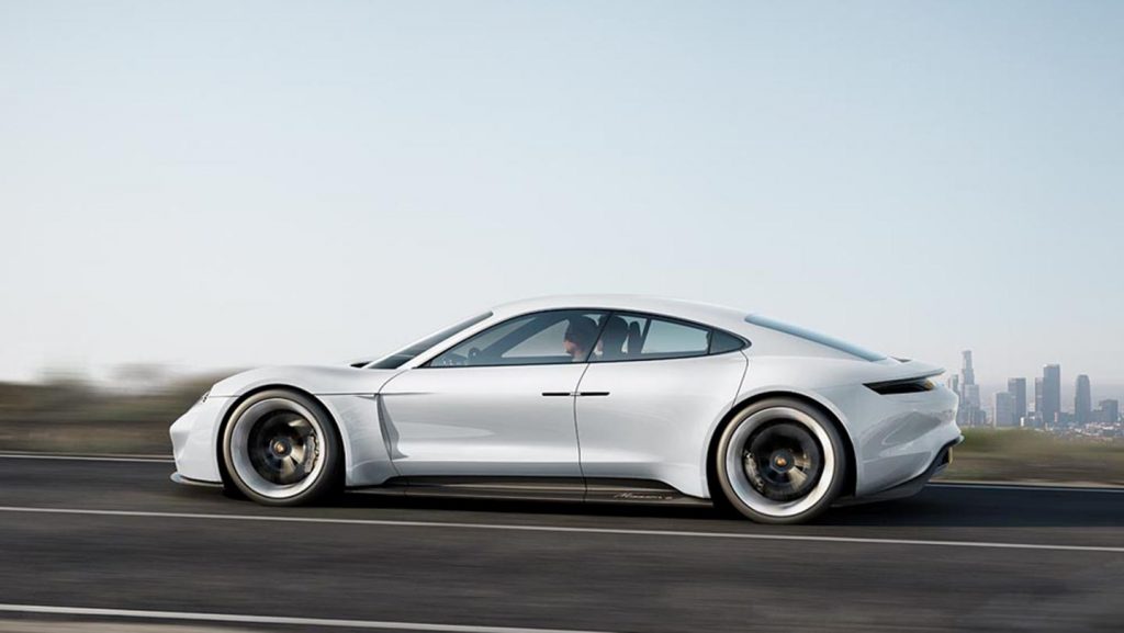 Concept Porsche Mission E Being Driven by a man side profile